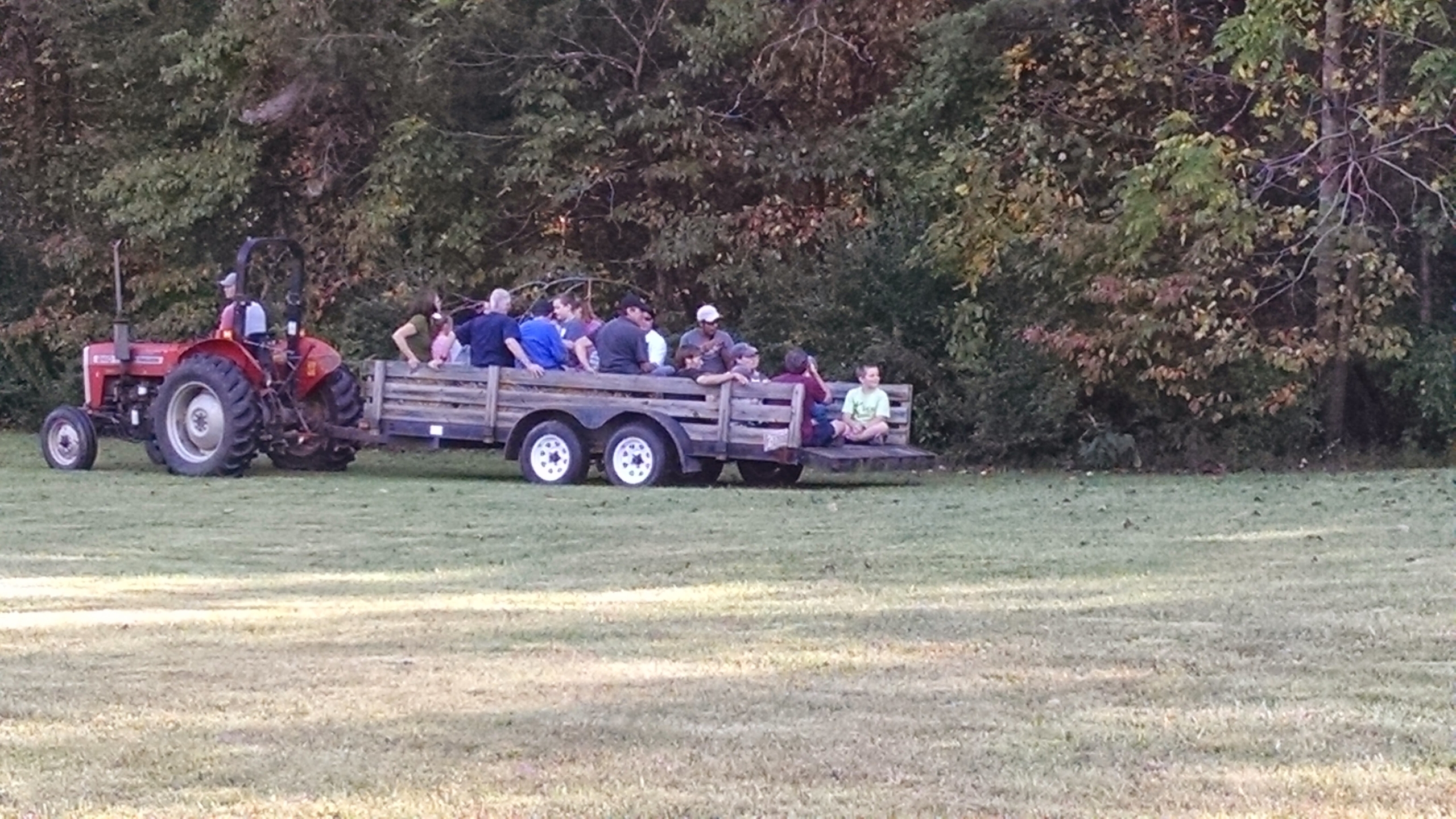 Group of people enjoying a tractor ride at an NC Fragile X event.
