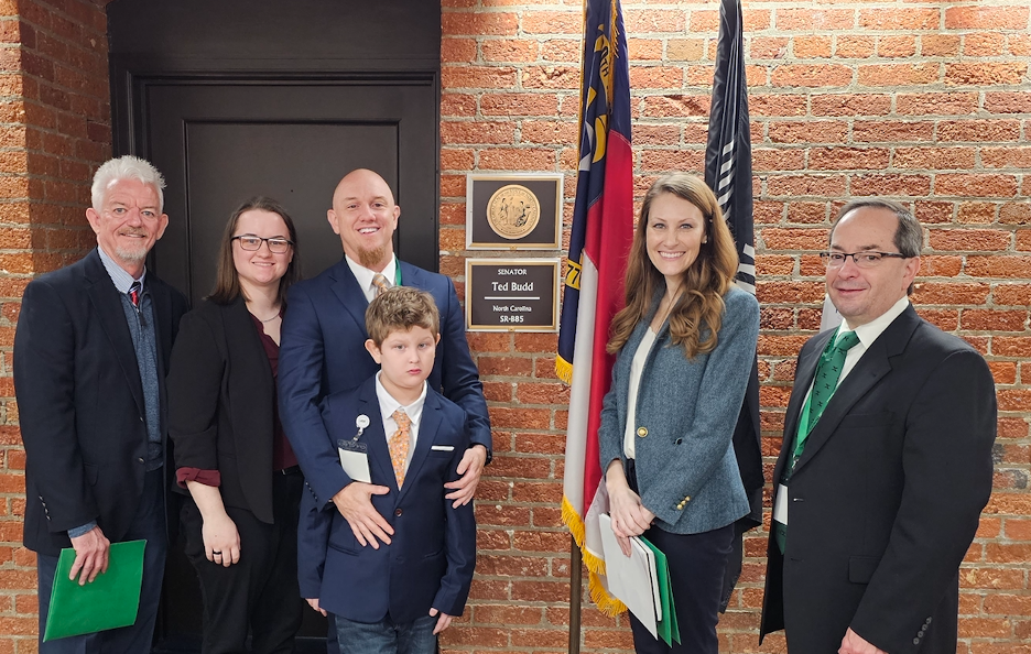 The North Carolina delegation is pictured in front of Senator Ted Budd's office: (L to R)
President Steve Strom, Wake Forest; Mary Haven Tillman, David Tillman and Miles Tillman (front), Lillington; Caitlin Miller, legislative aide to Senator Budd; and Stephen O'Quinn,  Wake Forest. 
