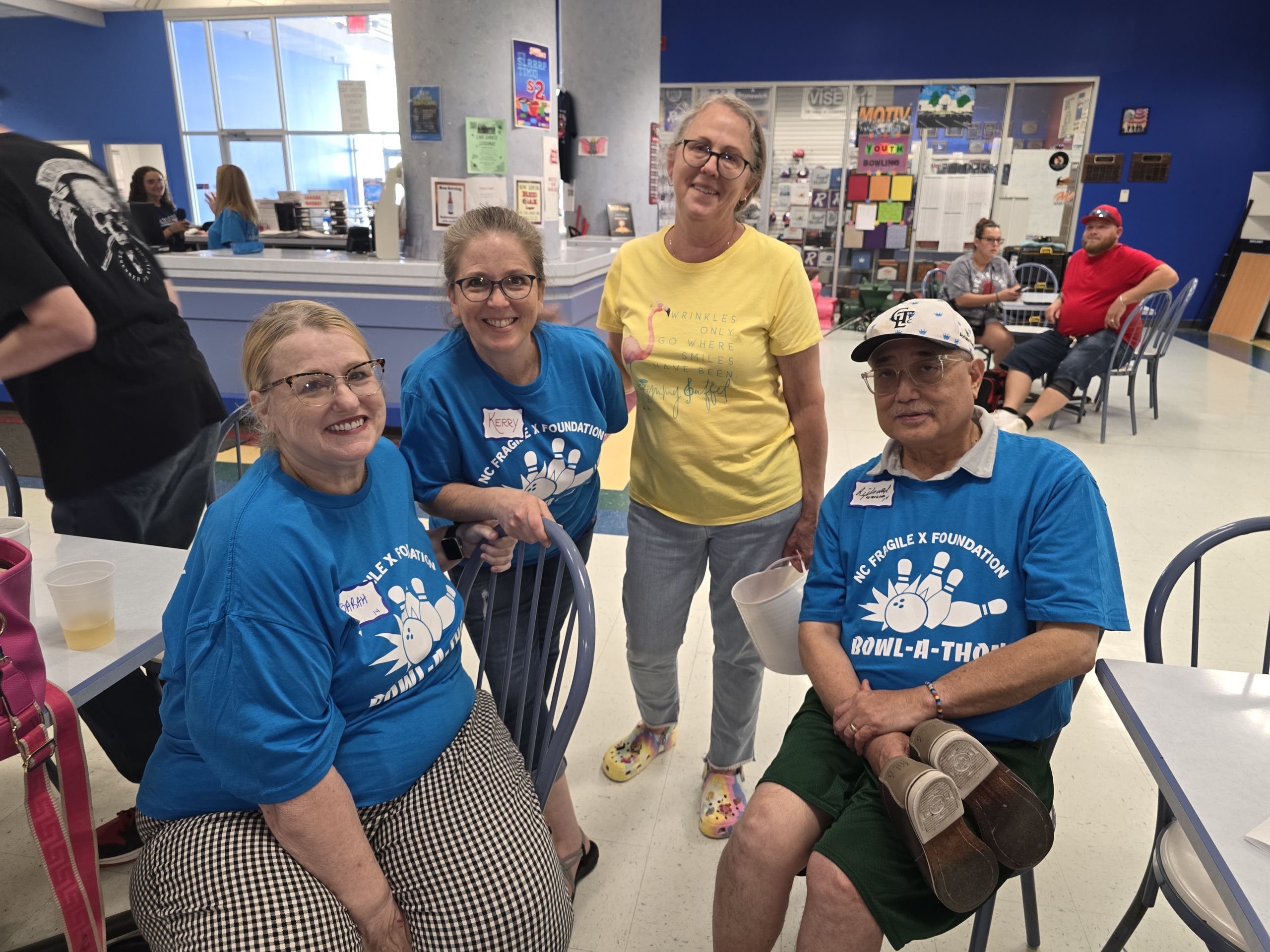Sarah Tamura, Kerry McCarthy Adams, Deby Burgess and Richard Tamura relax at the event.