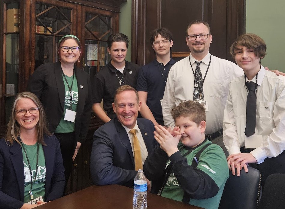 North Carolina delegates share their story with Senator Ted Budd. Seated (L to R): Dr. Kate Gregory (Asheville), Senator Budd, Miles Tillman, self advocate. Standing (L to R): Brittney Tillman, Andrew Miller, Thomas Miller, Tom Miller, and Brendon Miller (Clayton)