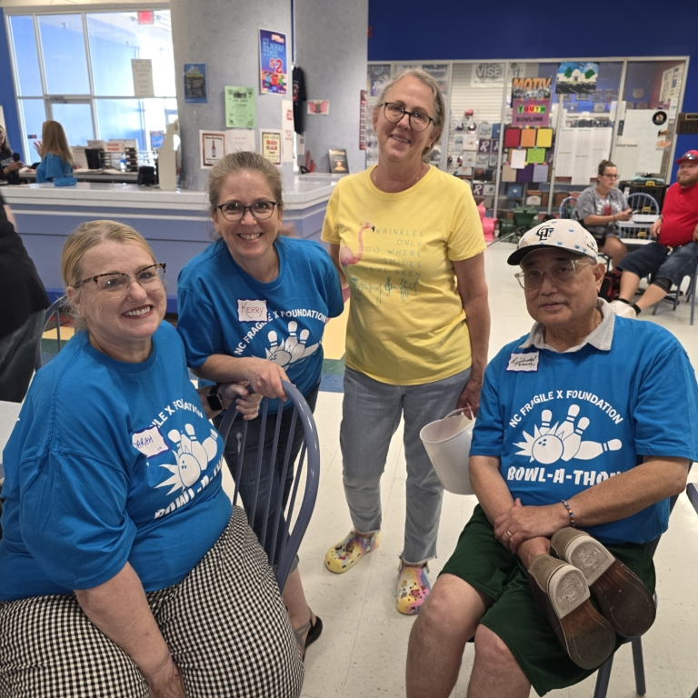 Sarah Tamura, Kerry McCarthy Adams, Deby Burgess and Richard Tamura relax at the event.