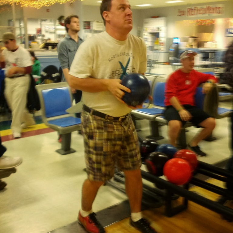 Gentleman at the NC Fragile X Bowl-A-Thon winding up to roll a strike.