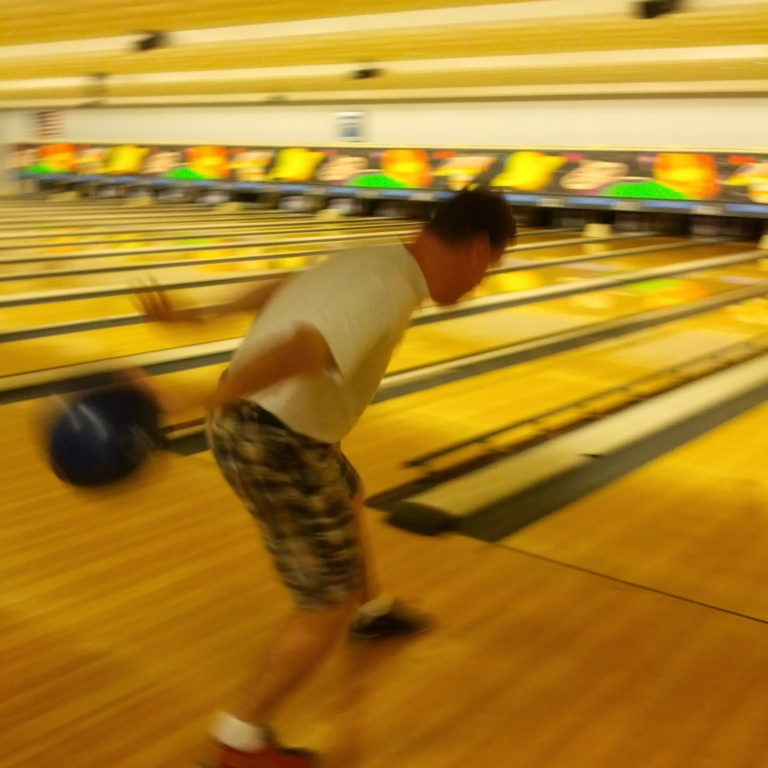 Gentleman winding up his bowling swing at the NC Fragile X Foundation Bowl-A-Thon.